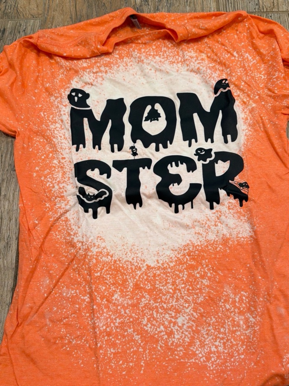 Orange "Momster" womenโs Graphic Tee